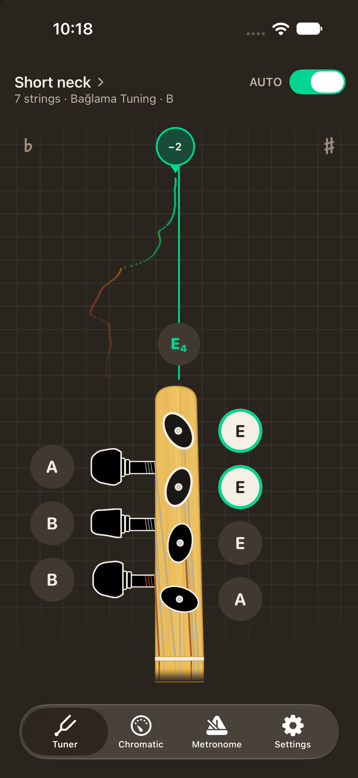 The redesigned Bağlama Tuner iOS app showing live pitch guidance beside a seven-string saz